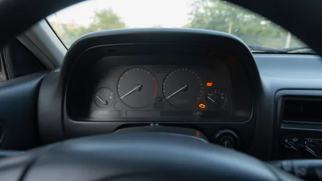 Toyota Corolla instrument cluster with the amber check engine symbol illuminated