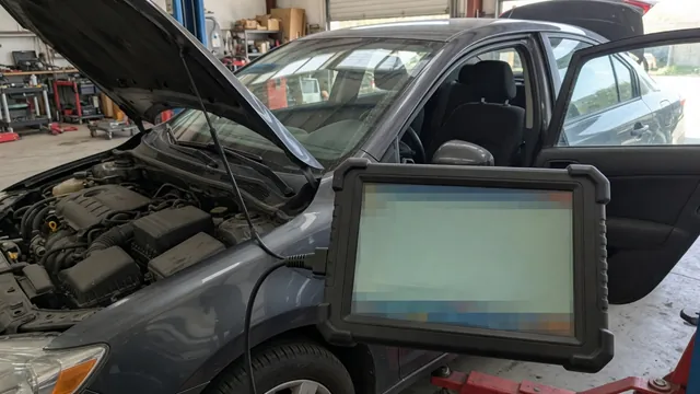 Diagnostic scan tool displaying P1506 beside a parked vehicle’s dashboard