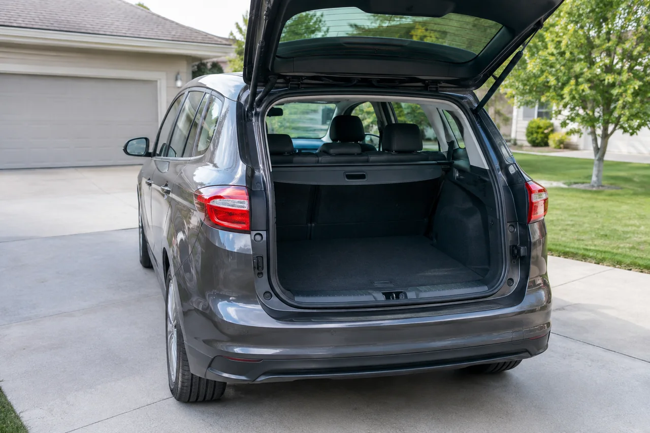 Ford C-Max Hybrid parked with its rear hatch open and cargo area visible