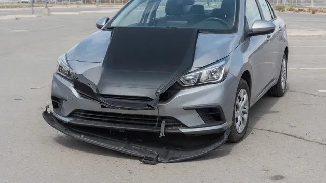 Parked car with a loose splash shield visible beneath the front bumper