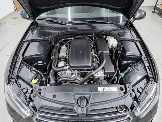 Illustration of a crankcase ventilation assembly and hoses in an Audi 2.0T engine bay