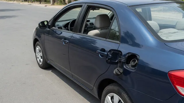 Fuel cap and filler opening shown during a visual check for a P0457 EVAP code