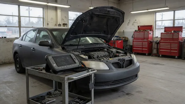 Diagnostic scanner beside a parked vehicle with its hood open