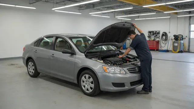 Technician inspecting the ignition coil area in a Mini Cooper engine bay