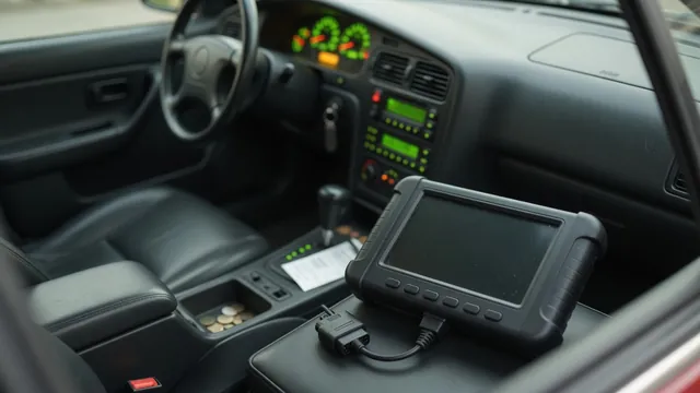 Diagnostic scan tool beside a vehicle with a transmission warning illuminated on the dashboard