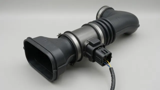 Illustration of an intake air duct with a mass air flow sensor and electrical connector