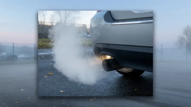 White vapor drifting from a parked car’s tailpipe on a cool morning outdoors