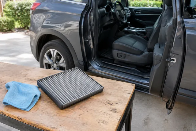 Cabin air filter and microfiber cloth ready for Chevrolet SUV interior maintenance