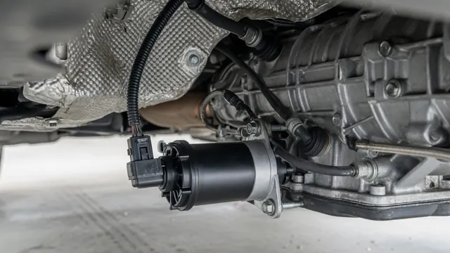 Electric auxiliary transmission fluid pump and wiring connector mounted near a car's automatic transmission housing