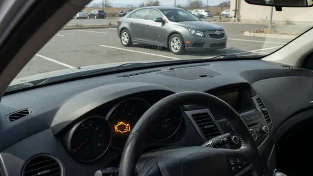 Illustration of a Chevrolet Cruze dashboard with an illuminated check engine symbol