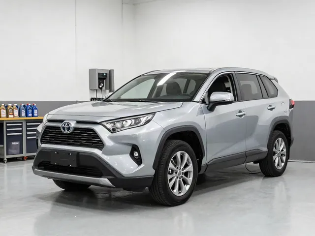 Toyota RAV4 and Highlander parked in a clean automotive service bay for rear drivetrain maintenance