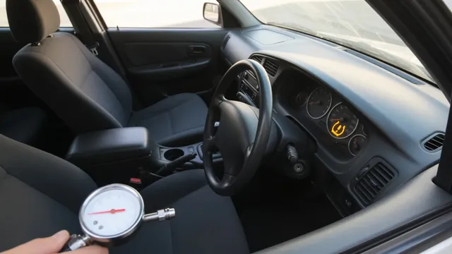Honda dashboard tire pressure warning with a tire pressure gauge in the foreground