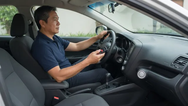 Nissan Altima driver holding a key fob near the steering wheel with the dashboard visible