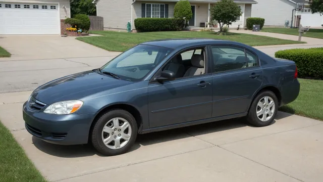 Car parked safely on a driveway with its tires and wheels visible during a visual inspection.