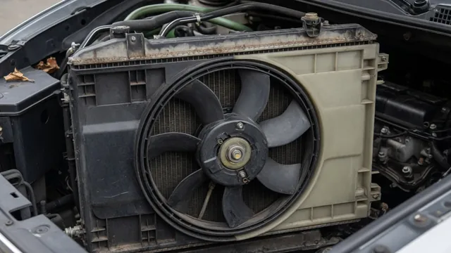 Radiator cooling fan and shroud behind a car radiator with the engine off