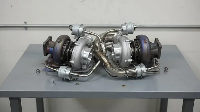 BMW N54 twin-turbo assembly showing turbine housings, wastegate actuators, and connected plumbing