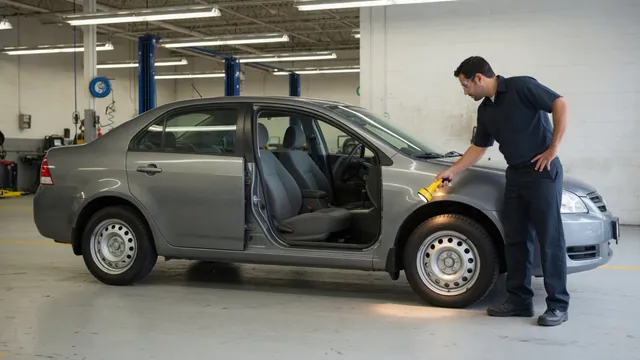 Honda CR-V parked in a service bay with a technician inspecting the wheel area
