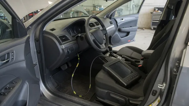 Diagnostic scanner connected inside a parked vehicle during a check of the P1051 trouble code