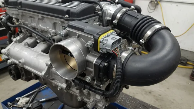 Illustration of an electronic throttle body and intake duct on a Hemi engine
