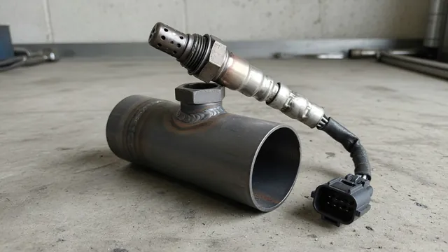 Illustration of an oxygen sensor threaded into a Chevy Cruze exhaust component with its wiring connector