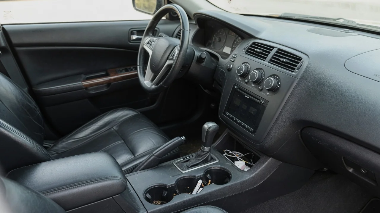 Automotive scene illustrating Why Does a Car Stereo Have a Fader Control