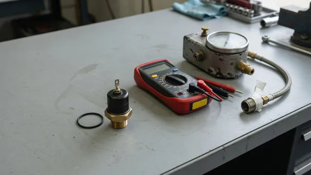 Oil pressure sending unit beside a digital multimeter and mechanical oil pressure test gauge on a workbench
