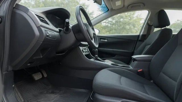 Driver’s view of a car dashboard, accelerator pedal, and floor where acceleration vibration may be felt
