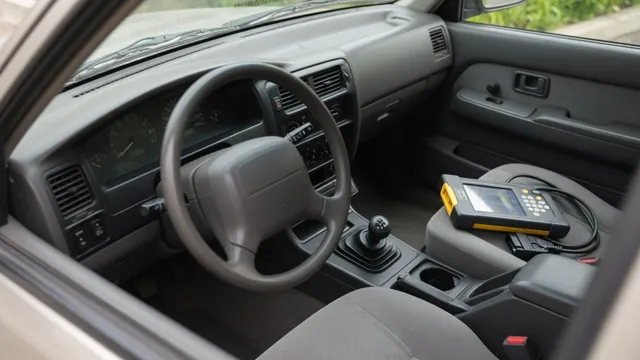 Vehicle instrument cluster with a 4WD mode indicator and a diagnostic scanner nearby