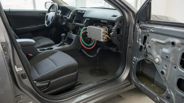 Car cabin cutaway showing the heater core, HVAC drain, and water trapped inside a door