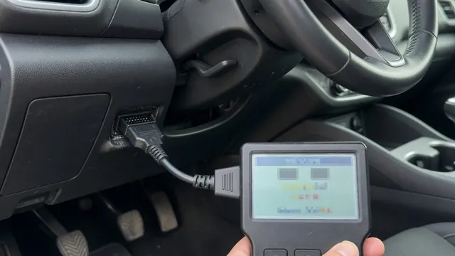OBD-II scan tool plugged into a car's diagnostic port, showing a trouble code reading