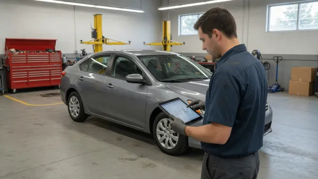 Technician reviewing transmission scan data beside a parked vehicle in a repair shop
