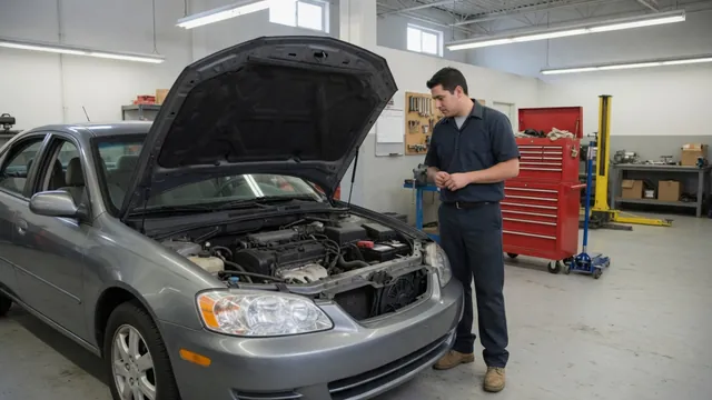 Volkswagen Jetta with its hood open for an ignition system inspection in an automotive workshop