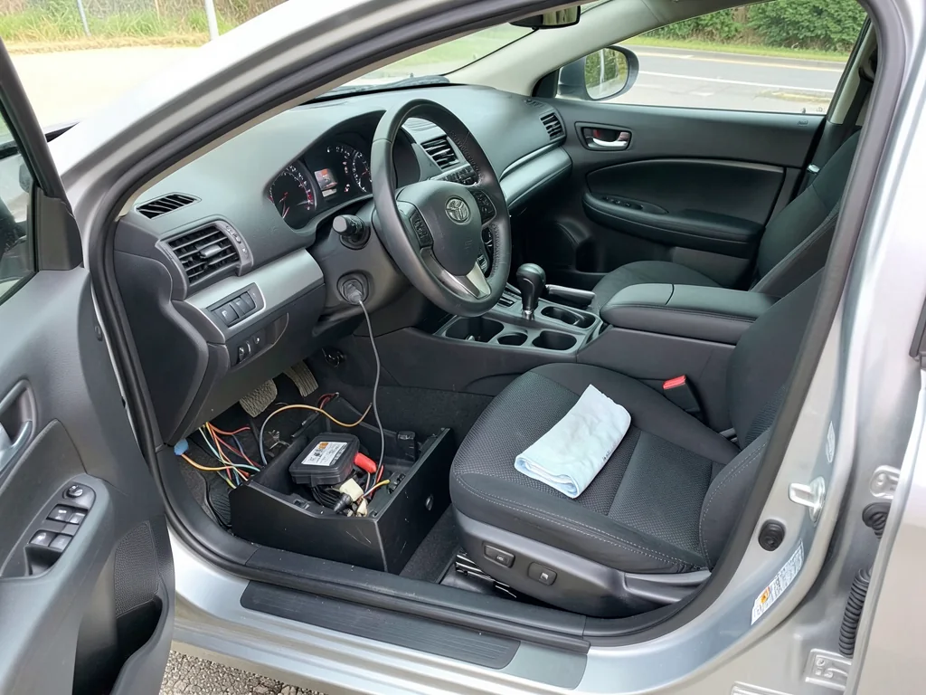 Toyota cabin air filter beside an open glove compartment with the filter access cover visible