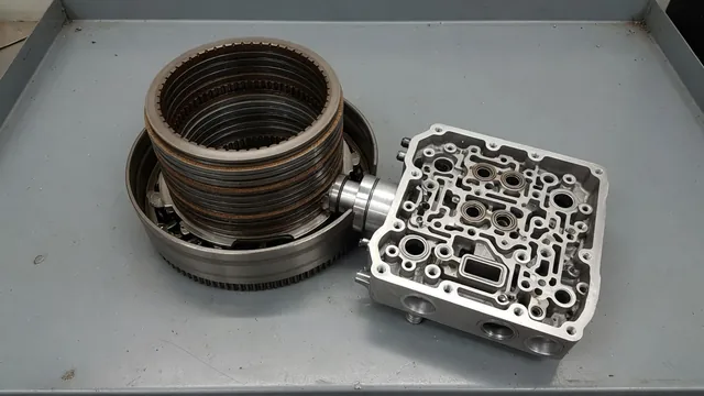 Transmission clutch pack and hydraulic valve body on a clean automotive workbench