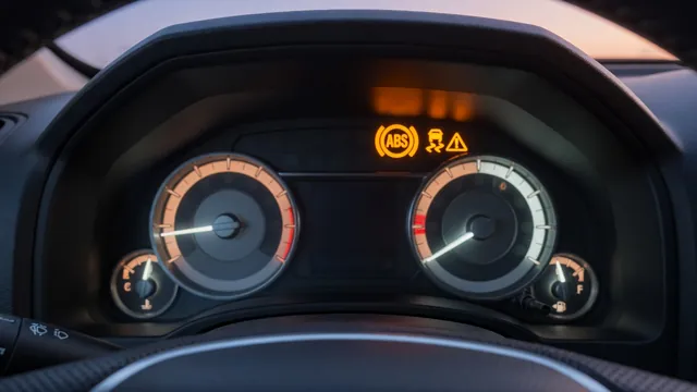 Pickup truck instrument cluster with the amber ABS warning light and traction control light lit