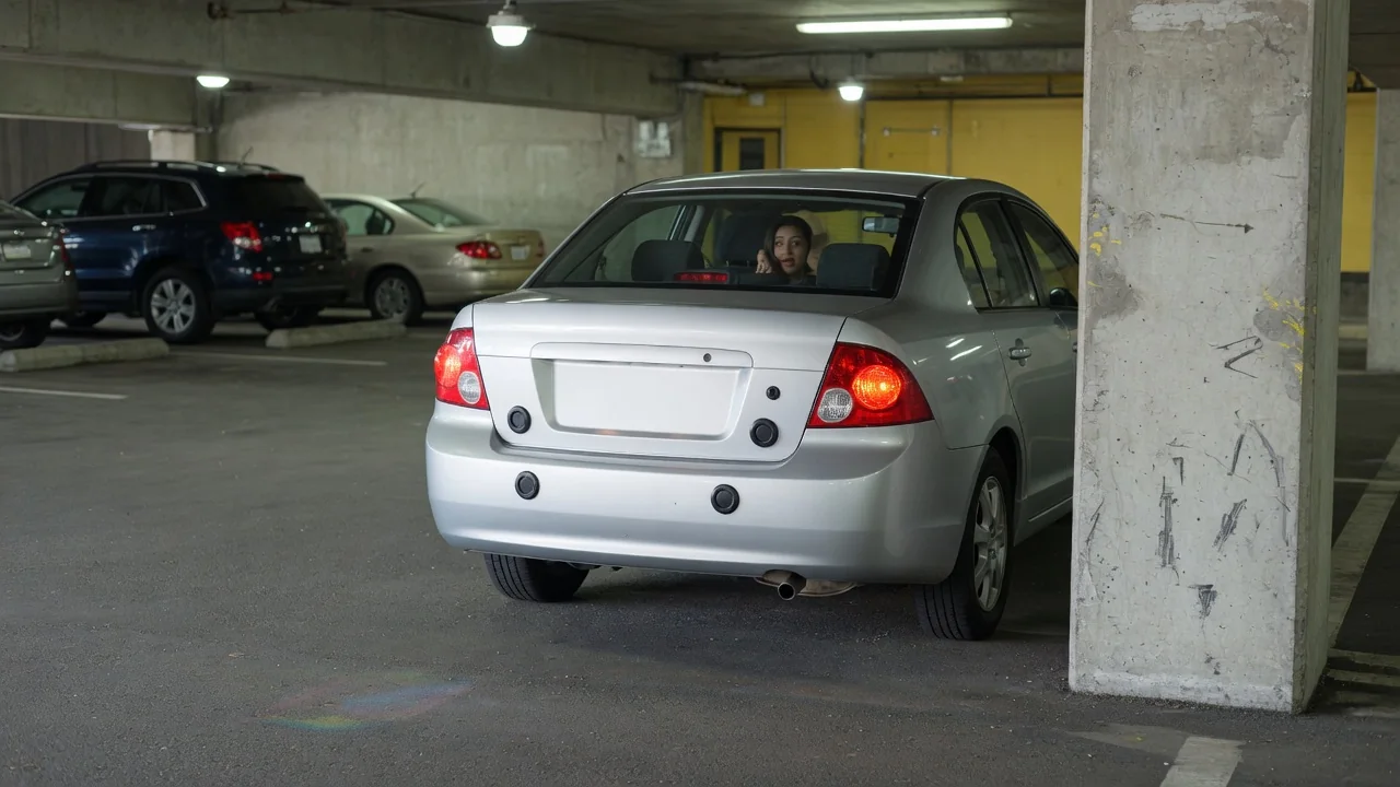 Automotive scene illustrating Why Do Parking Sensors Beep Faster Near an Obstacle