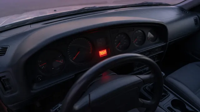 Dashboard oil pressure gauge at zero with an illuminated oil warning light and the vehicle parked