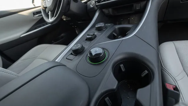 Automotive scene illustrating What Is a Hybrid EV Mode Button