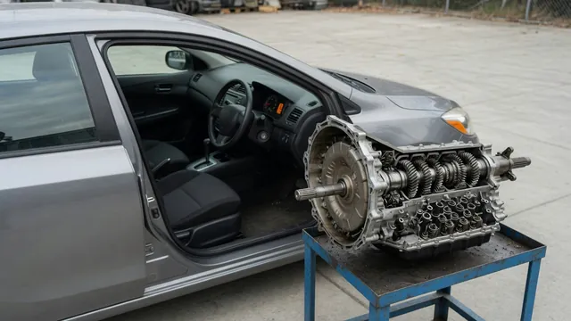 Dashboard transmission warning with an automatic transmission cutaway shown beside the vehicle