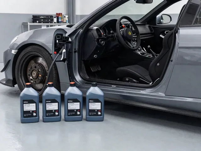 Sealed brake fluid containers beside a track car in a clean garage