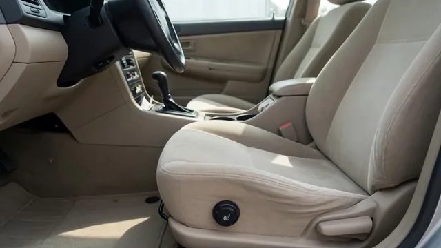 Car interior showing a heated seat control beside the front seat