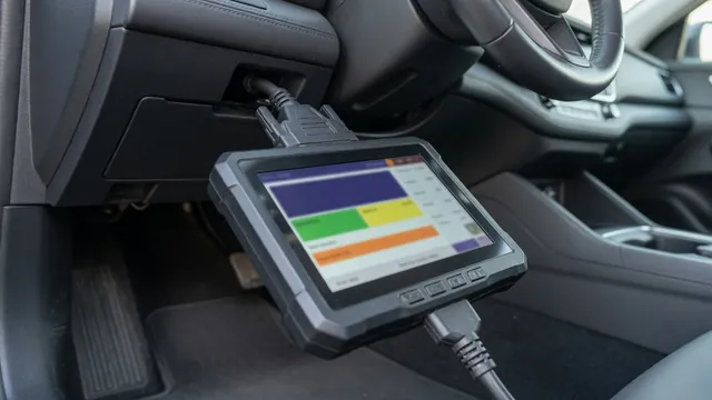 OBD-II scan tool plugged in under a car dashboard, showing a stored trouble code