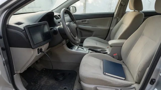Diagnostic scanner connected inside a parked vehicle for a trouble-code check