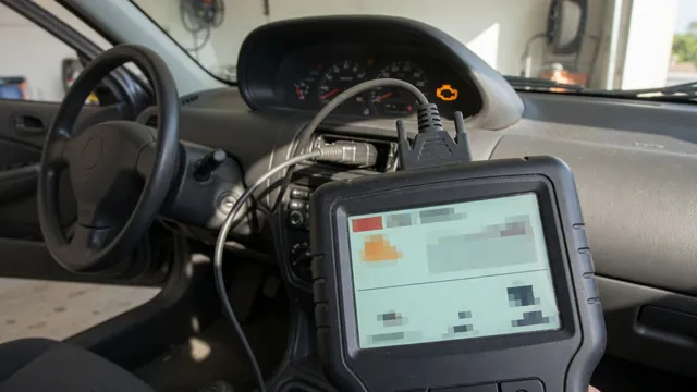 OBD-II scanner plugged in under a dashboard to read a P1628 trouble code, with the check engine light on