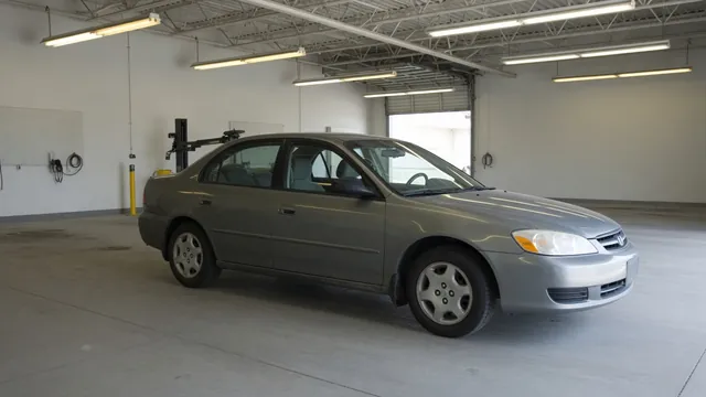 Nissan Altima parked in a service bay for a fuel delivery inspection