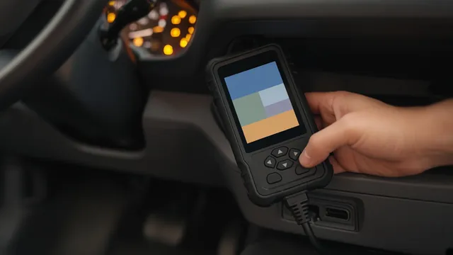 Diagnostic scan tool connected to a car's OBD-II port showing a chassis trouble code reading