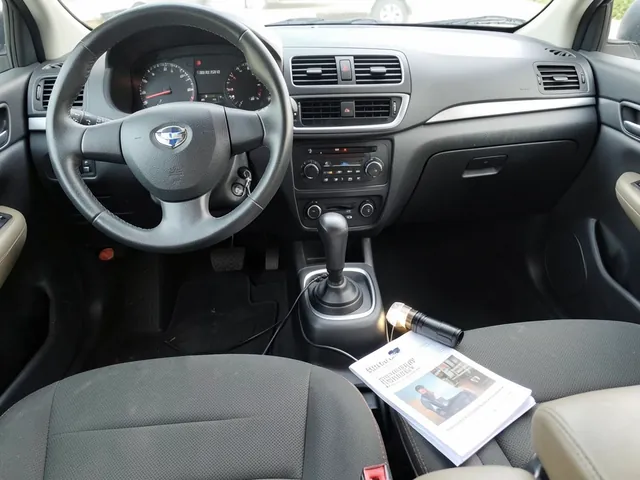 Illustration of a cabin air filter beside an open glove compartment in a vehicle interior