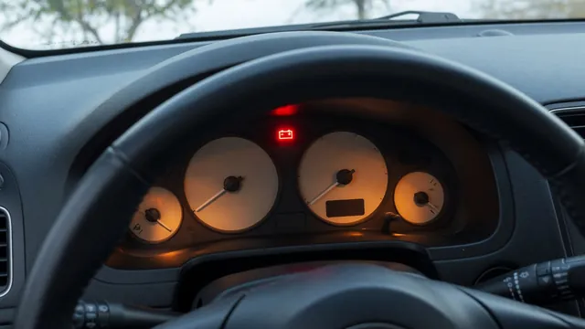 Illuminated battery-shaped charging warning light on a vehicle dashboard