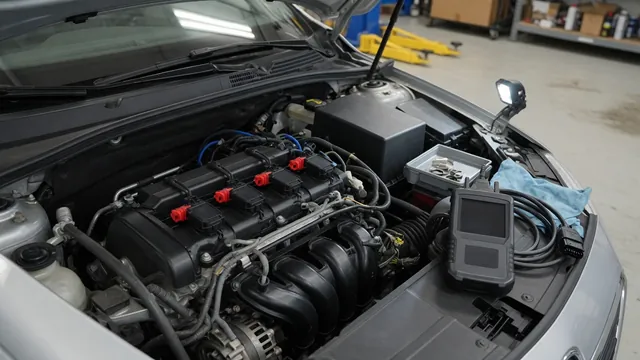 Ignition coil connectors on an engine with a diagnostic scan tool nearby