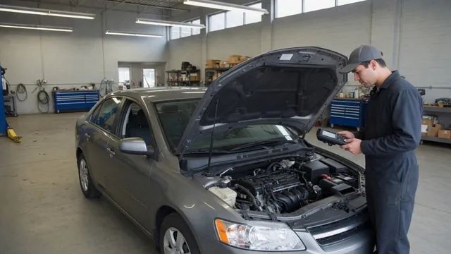 Technician reviewing vehicle communication fault codes on a diagnostic scanner beside an open hood